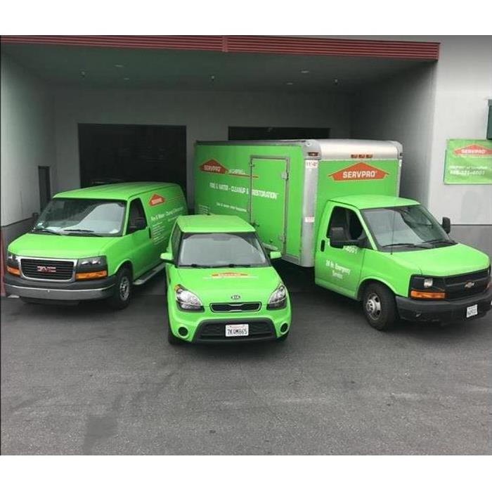 SERVPRO vehicles in front of SERVPRO building