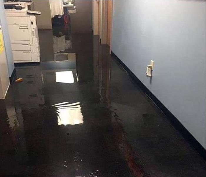 standing water in a commercial building, flooded commercial building