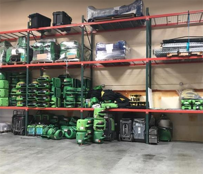 SERVPRO restoration equipment stacked inside warehouse
